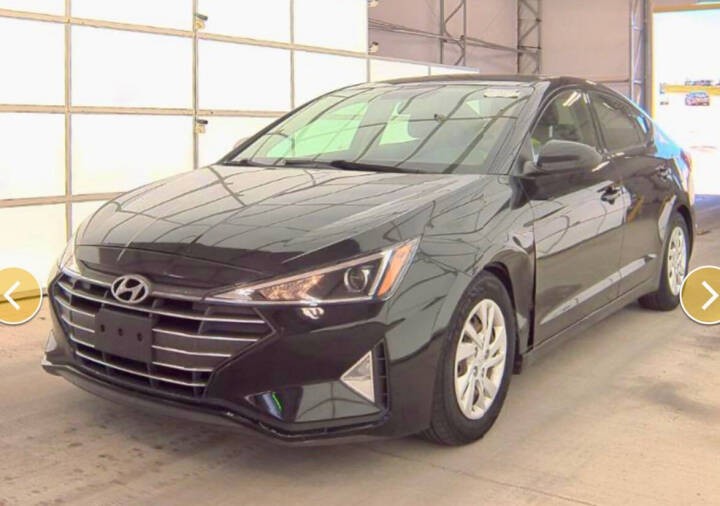 Hyundai Elantra and Ford Fusion on display